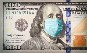 Benjamin franklin with worried and concerned expression wearing medical face mask on one hundred dollar bill