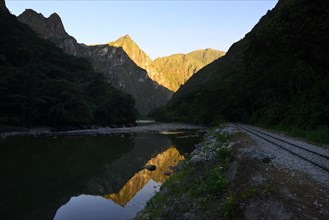 Reflection of the Rio Urubamba at the railway line to Aguas Calientes