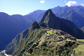 Inca ruined city with Mount Huayna Picchu