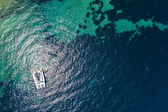 Aerial of a sailing boat on Zografou Beach