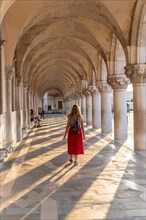 Young woman in the portico at the Doge's Palace