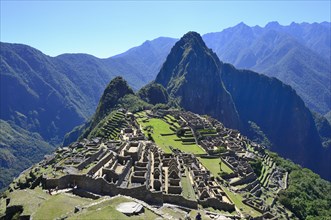 Inca ruined city with Mount Huayna Picchu