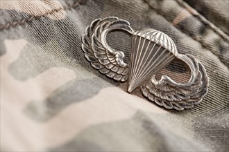 Paratrooper war medal on a camouflage material