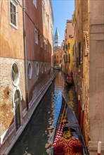 Narrow canal with gondola
