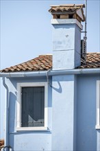 Blue house with chimney