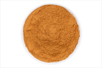 Cinnamon spice powder from above clipping frame against a white background
