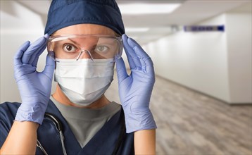 Banner of Female Doctor or Nurse In Medical Face Mask and Protective Gear In Hospital Hallway