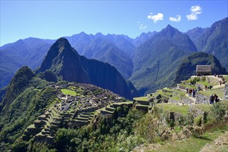 Inca ruined city with Mount Huayna Picchu