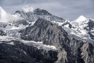 Snow covered mountain peaks Jungfrau and Silberhorn with glacier Jungfraufirn