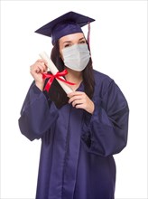 Graduating female wearing medical face mask and cap and gown isolated on a white background