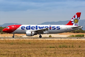 An Edelweiss Airbus A320 with registration HB-JJK lands at Palma de Majorca Airport