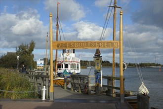 Port of Zingst with sailing boat and excursion boat
