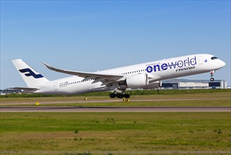A Finnair Airbus A350-900 with the registration OH-LWB in the OneWorld special livery takes off from Helsinki Airport