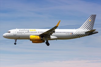 A Vueling Airbus A320 with the registration EC-MJB lands at Barcelona Airport
