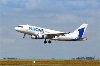A FlyOne Airbus A319 with registration ER-00002 takes off from Charles de Gaulle Airport