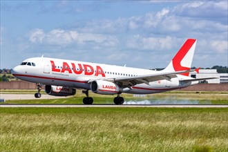 A Lauda Airbus A320 aircraft with registration number OE-LOY lands at Stuttgart Airport