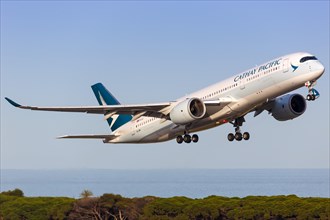 A Cathay Pacific Airbus A350-900 with registration B-LRN takes off from Barcelona Airport