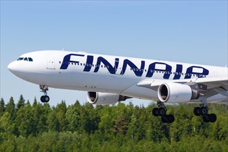 A Finnair Airbus A330-300 with the registration OH-LTS lands at Helsinki Airport