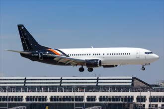 A Titan Airways Boeing 737-400 with registration G-POWS lands at Stuttgart Airport