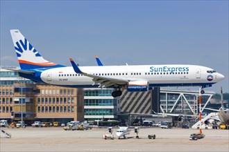 A SunExpress Boeing 737-800 with registration TC-SNZ lands at Stuttgart Airport
