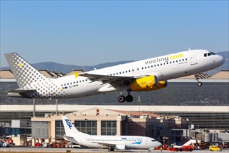 A Vueling Airbus A320 with the registration EC-MVM takes off from Malaga Airport