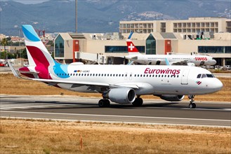 A Eurowings Airbus A320 with the registration D-AEWO takes off from the airport in Palma de Majorca