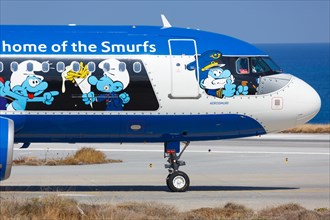 An Airbus A320 aircraft of Brussels Airlines with the registration number OO-SND with the special livery The Smurfs at Heraklion Airport