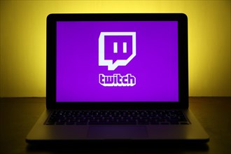 Logo of the streaming platform twitch for gamers on a laptop