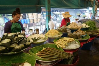 Neatly prepared and displayed vegetable produce in covered food market