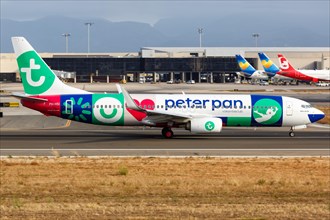 A Transavia Boeing B737-800 with the registration PH-HSI and the special livery Peter Pan Vakantieclub takes off from Palma de Majorca Airport