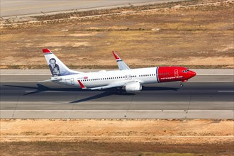 A Norwegian Boeing B737-800 with the registration EI-FHZ and Andre Bjerke on the tail takes off from Palma de Majorca Airport