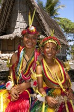 Girl and boy decorated for traditional bamboo dance