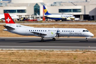 A Saab 2000 aircraft of SkyWork Airlines with registration HB-IZD takes off from Palma de Majorca Airport