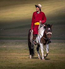A rider on horseback in the morning