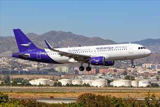 A Wataniya Airways Airbus A320 with registration number 9K-EAH lands at Malaga Airport