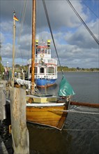 Port of Zingst with sailing boat and excursion boat