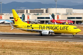 A TUIfly Boeing B737-800 with the registration D-ATUG and the special livery TUI Magic Life takes off from the airport in Palma de Majorca