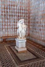 Mosaic and statue with Centaurus in marble at Ca' d'Oro Palace