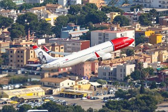 A Norwegian Boeing B737-800 with the registration EI-FHZ and Andre Bjerke on the tail takes off from Palma de Majorca Airport