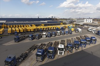 Parking lot with articulated lorry and semi-trailer