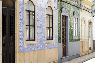 Beautiful houses cover with traditional tiles called azulejo