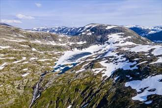 Aerial of a mountain lake in the mountains over Geirangerfjord