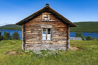 Historic houses on the Karasjohka river bordering Norway and Finland