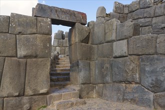 Stone gate in the fortress wall of the Inca ruins Sacsayhuaman