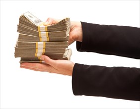 Woman handing over hundreds of dollars isolated on a white background