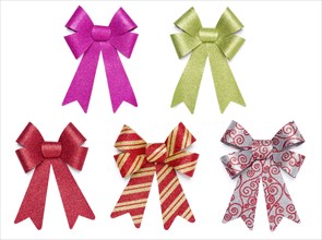 Set of five multicolored glitter bows and ribbons on white background