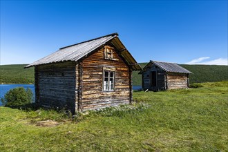 Historic houses on the Karasjohka river bordering Norway and Finland