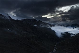 Blue hour over Windbachtal with dramatic clouds