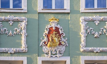 Stucco with sailing ship on a baroque facade of a residential house