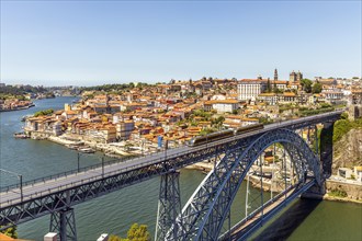 Beautiful panorama of city of Porto with metro on famous bridge